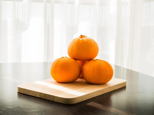 Oranges set on wooden base — Stock Photo, Image