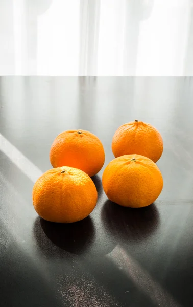 Oranges set on wooden base — Stock Photo, Image