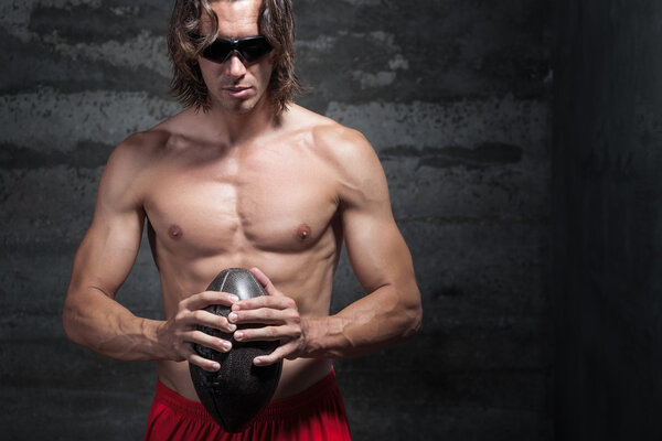 Bare chested long hair muscle man