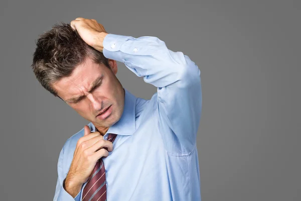 Podnikatel má bolesti hlavy — Stock fotografie