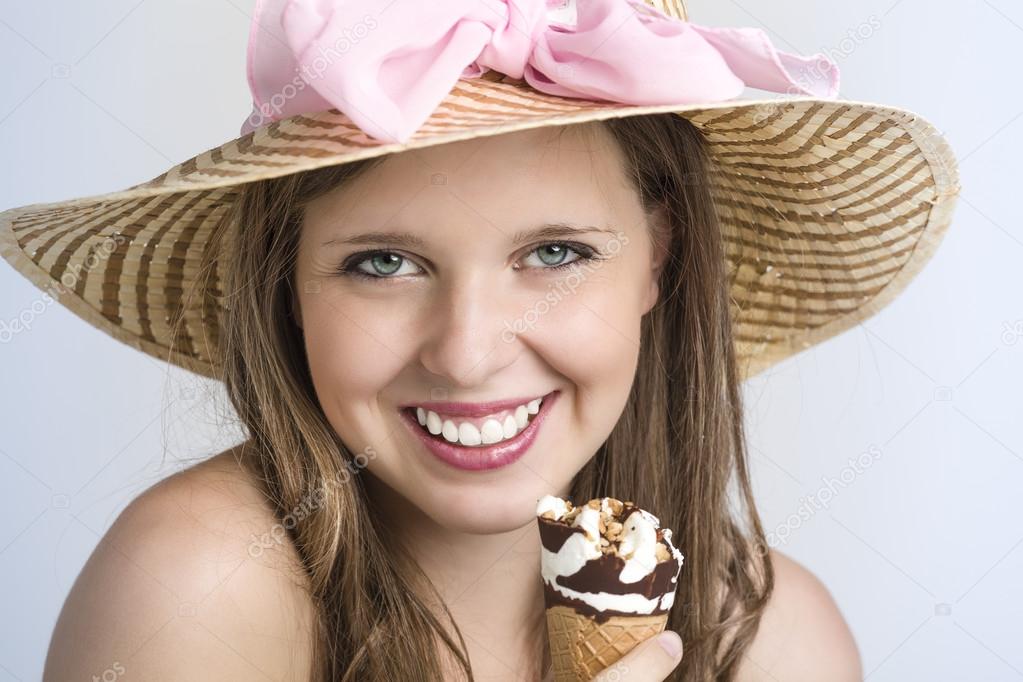 Very nice teenager smiling and enjoying her ice cream