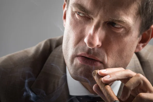 Severe gaze of elegant smoker — Stock Photo, Image