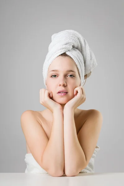 Beautiful young girl wearing white towel on her head — Stock Photo, Image