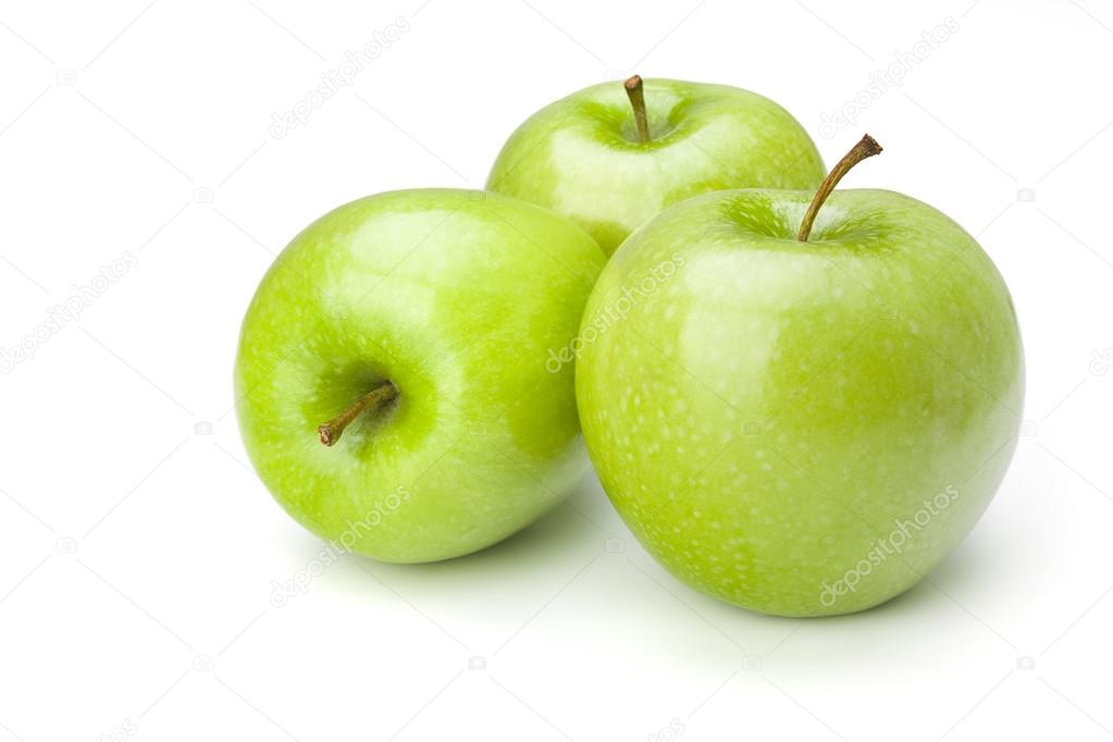 Three green apples on white background