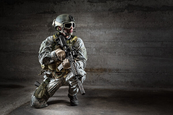Soldier with mask rifle and backpack Stock Image