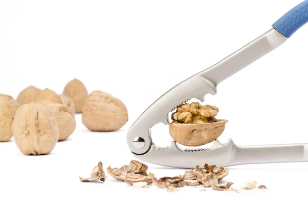 Walnut and nutcracker on white background — Stock Photo, Image