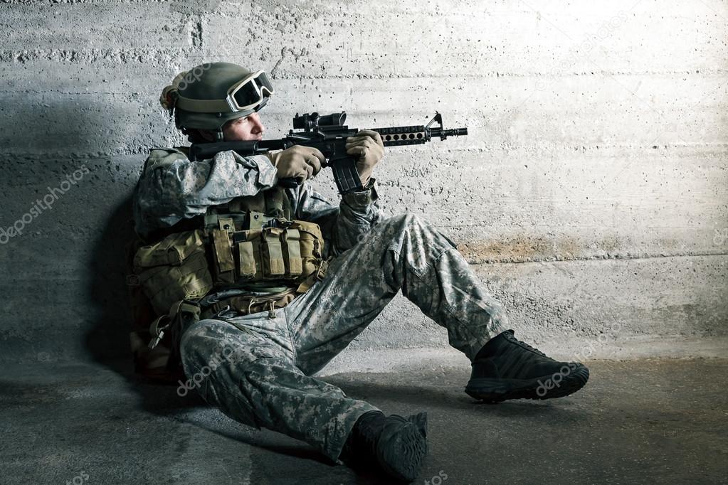 Soldier aiming a rifle