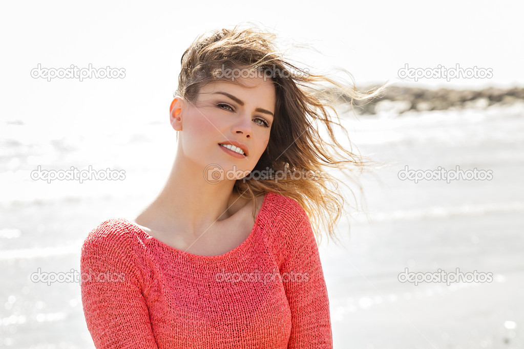Wind hair beautiful girl smiling on camera