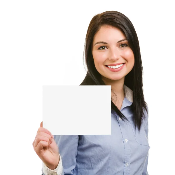 Χαμογελώντας νεαρή γυναίκα δείχνει κενό πινακίδα — Φωτογραφία Αρχείου