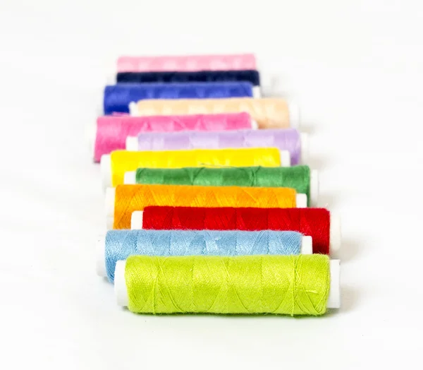 Multi colored bobbins of thread for sewing — Stock Photo, Image