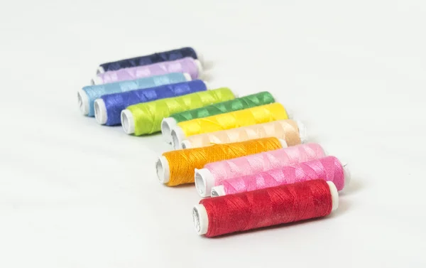 Multi colored bobbins of thread for sewing — Stock Photo, Image
