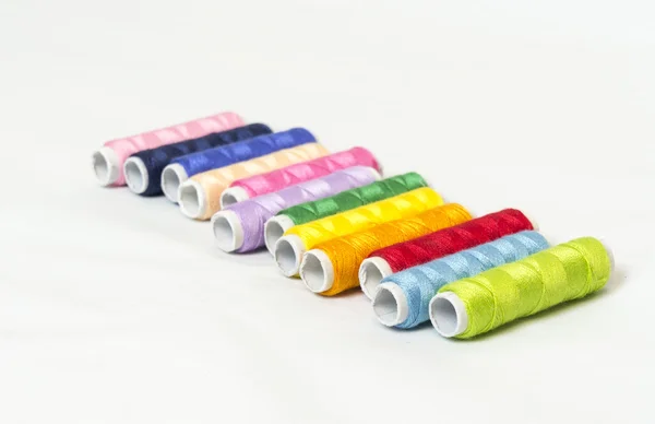 Multi colored bobbins of thread for sewing — Stock Photo, Image