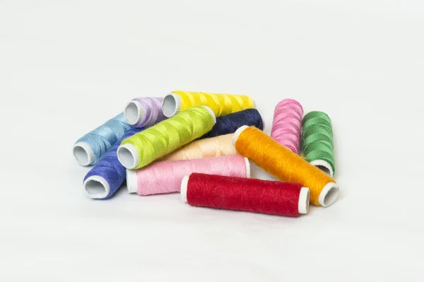 Multi colored bobbins of thread for sewing — Stock Photo, Image