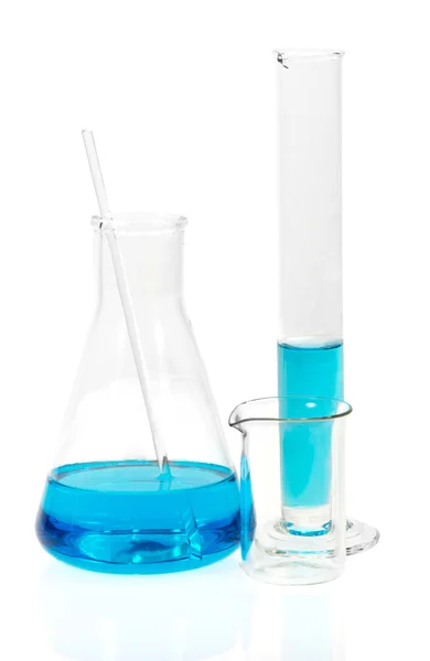 Laboratory glassware with blue liquid isolated on white — Stock Photo, Image