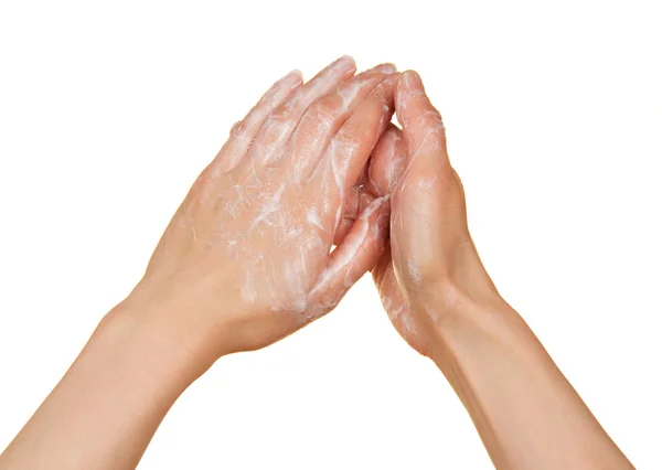 Schuim van zeep en vrouwelijke handen, geïsoleerd op wit — Stockfoto