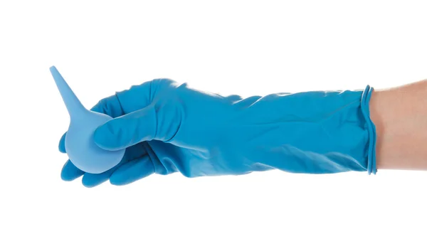 Hand in a glove, holding the children's enema, isolated on white — Stock Photo, Image