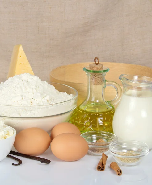 Dairy products, sunflower oil and the spices on the beige — Stock Photo, Image