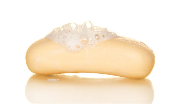 Beige soap in the foam, isolated on white — Stock Photo, Image