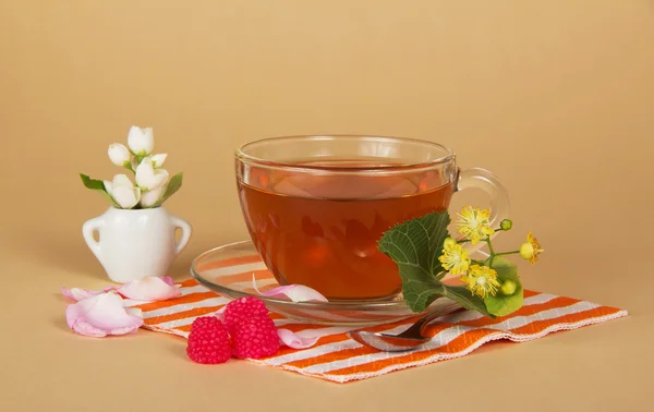 Napkin, tea, flowers and raspberry — Stock Photo, Image