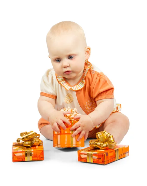 Cute baby keeps colorful gift box isolated on white — Stock Photo, Image