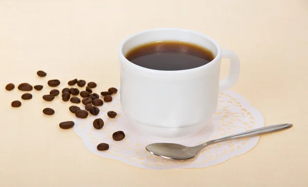 Cup of coffee on a beige background — Stock Photo, Image