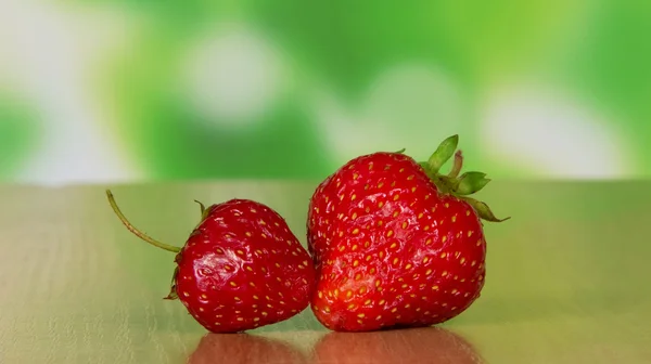 Two berries of strawberry on a table — Stock Photo, Image