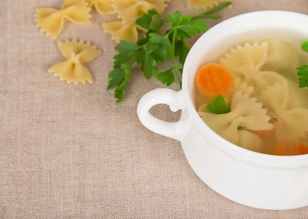 Dietary macaroni soup and pasta on a sackcloth — Stock Photo, Image