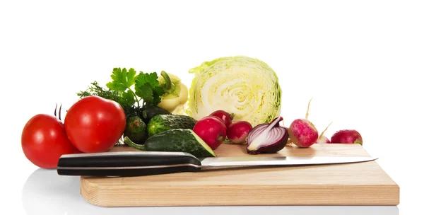 Set of vegetables and knife on the chopping board — Stock Photo, Image