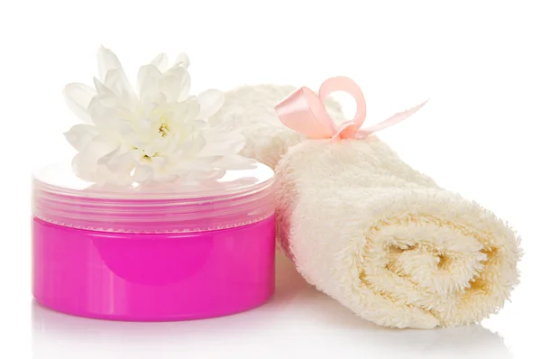 Cream in pink packing, a towel and a chrysanthemum, isolated on the white — Stock Photo, Image