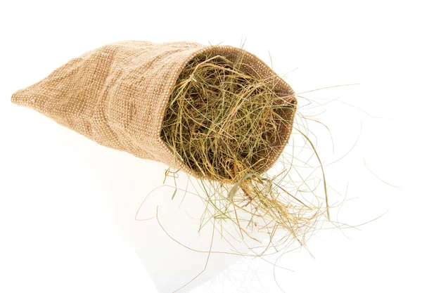 Small sack with the hay, isolated on white — Stock Photo, Image