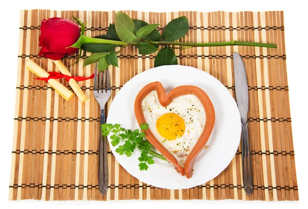 Festive a breakfast on Valentine's Day, sausage in the form of heart, red rose, notes with prediction isolated on white — Stock Photo, Image