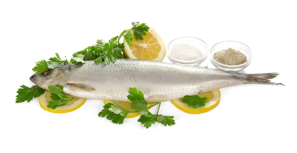 Herring on lemon slices, salt of spice and parsley — Stock Photo, Image