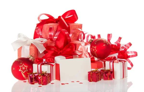 Christmas gifts, toys, a tinsel and blank card — Stock Photo, Image