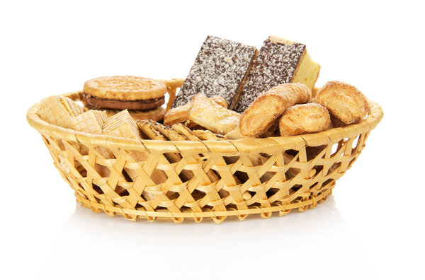 Set of sweet cookies in the wattled basket, isolated on white