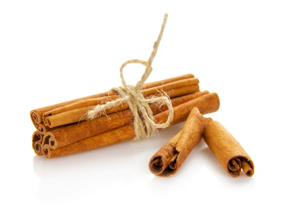 Heap of the connected sticks of the cinnamon isolated on white — Stock Photo, Image