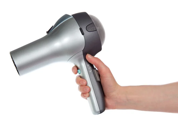 Saç üzerinde beyaz izole bir el kurutma makinesi — Stok fotoğraf