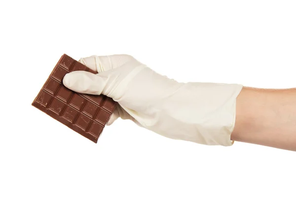 Poreuze melk chocolade in een hand van de kok van de banketbakker — Stockfoto