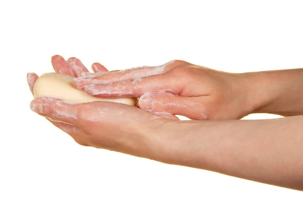 Mani femminili con il sapone, isolate su bianco — Foto Stock