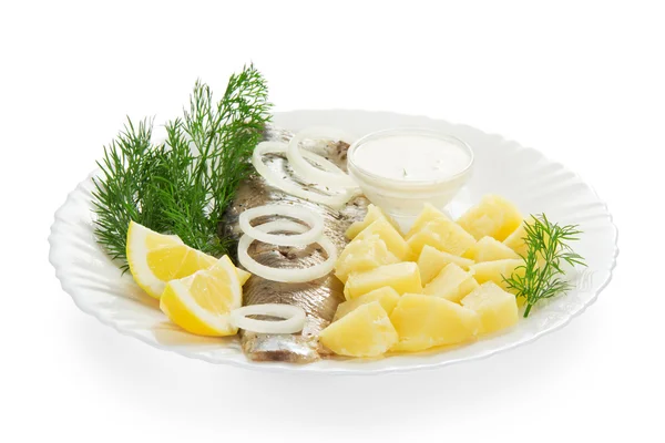 Slices of a herring and potato, the onions rings isolated on white — Stock Photo, Image