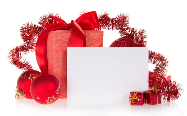 Gift box, spheres, tinsel and card for the congratulations, isolated on white — Stock Photo, Image