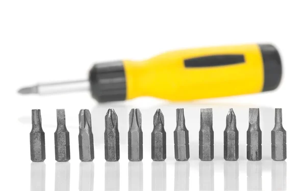 Mechanical screwdriver and set of the heads, isolated on white — Stock Photo, Image