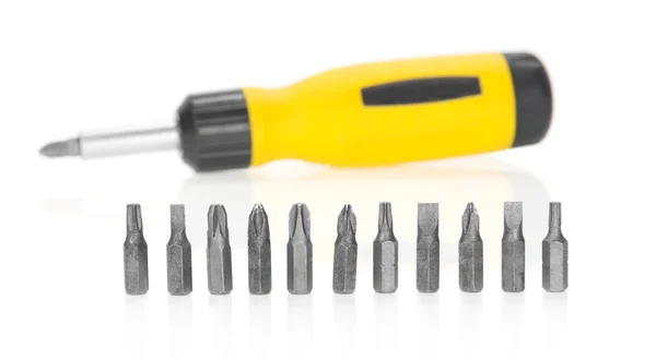 Mechanical screwdriver and set of the heads, isolated on white — Stock Photo, Image
