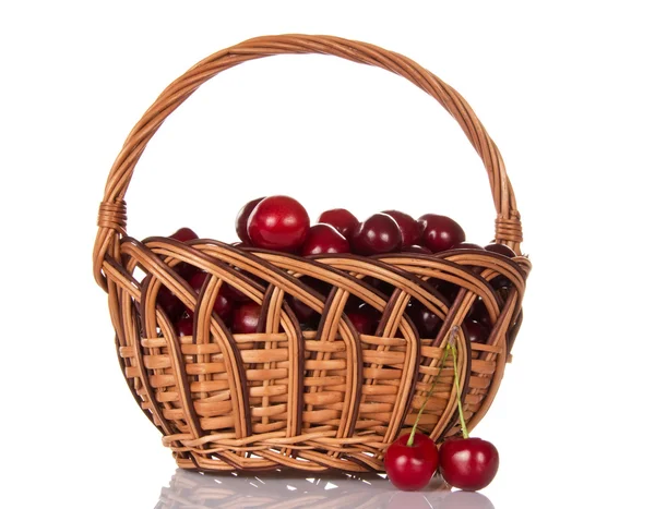 Full basket of ripe sweet cherry and some berries near — Stock Photo, Image