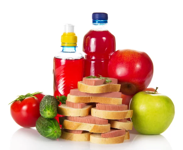 Sandwiches, vegetables, apples and bottles with the compote — Stock Photo, Image