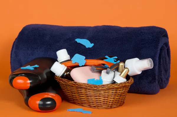 Big terry towel and basket with cosmetics — Stock Photo, Image