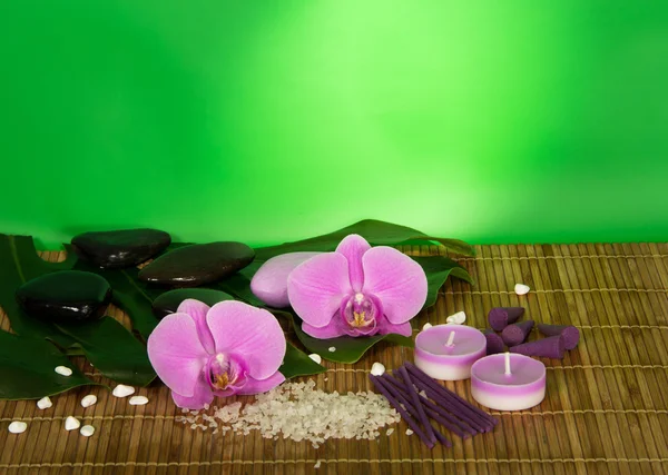 Orchid flowers, set for Spa on a bamboo cloth