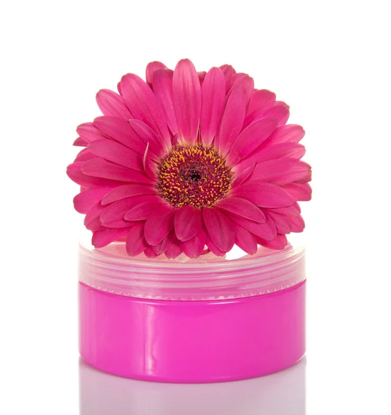 Cosmetic cream in the pink container and flower of Gerbera — Stock Photo, Image