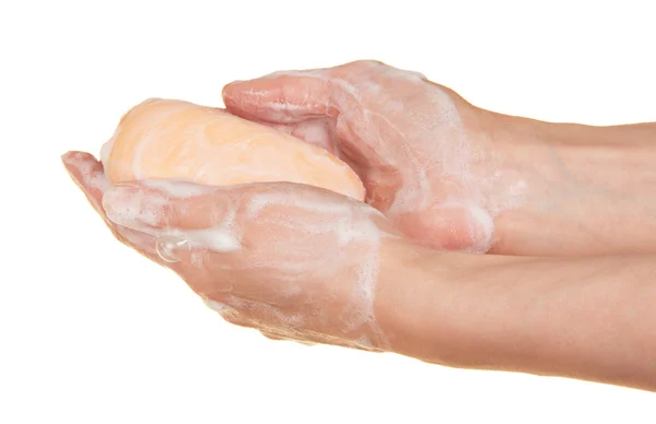 Jabón en las manos femeninas, aislado en blanco — Foto de Stock