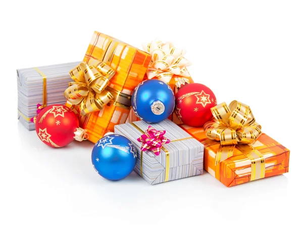 Bright christmas gifts and blue, red balls isolated on white — Stock Photo, Image