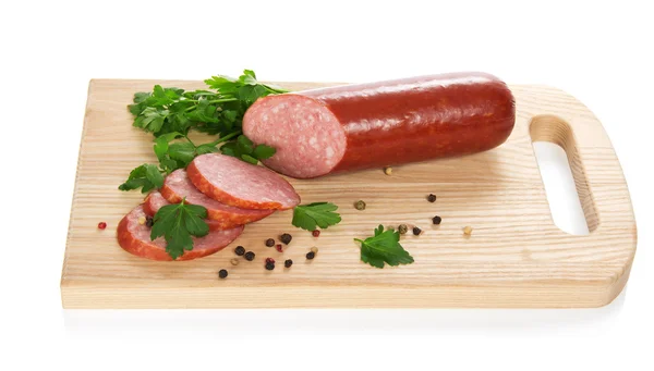 Sausage, parsley, spices on the chopping board, isolated on white — Stock Photo, Image